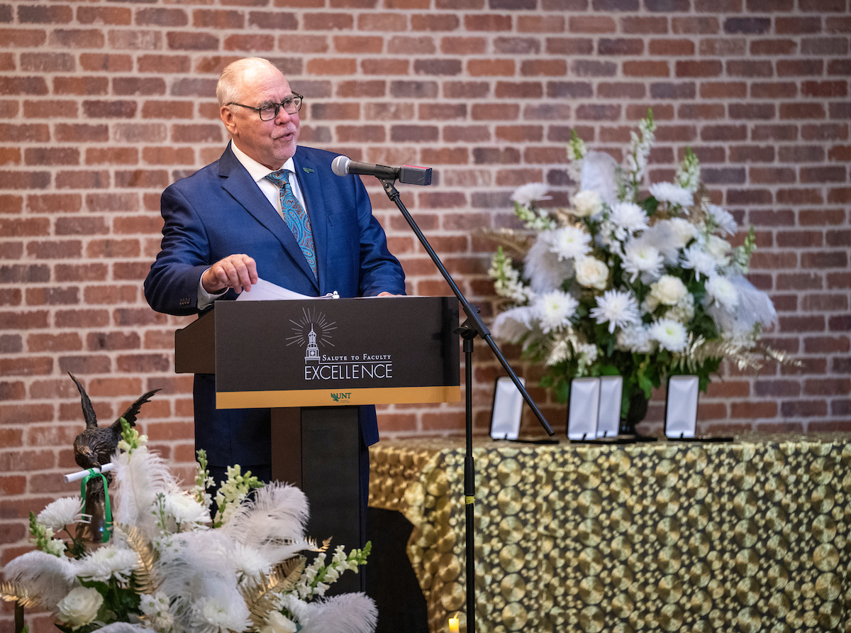 Dr. Neal Smatresk giving presentation at Salute to Faculty Excellence Awards Ceremony