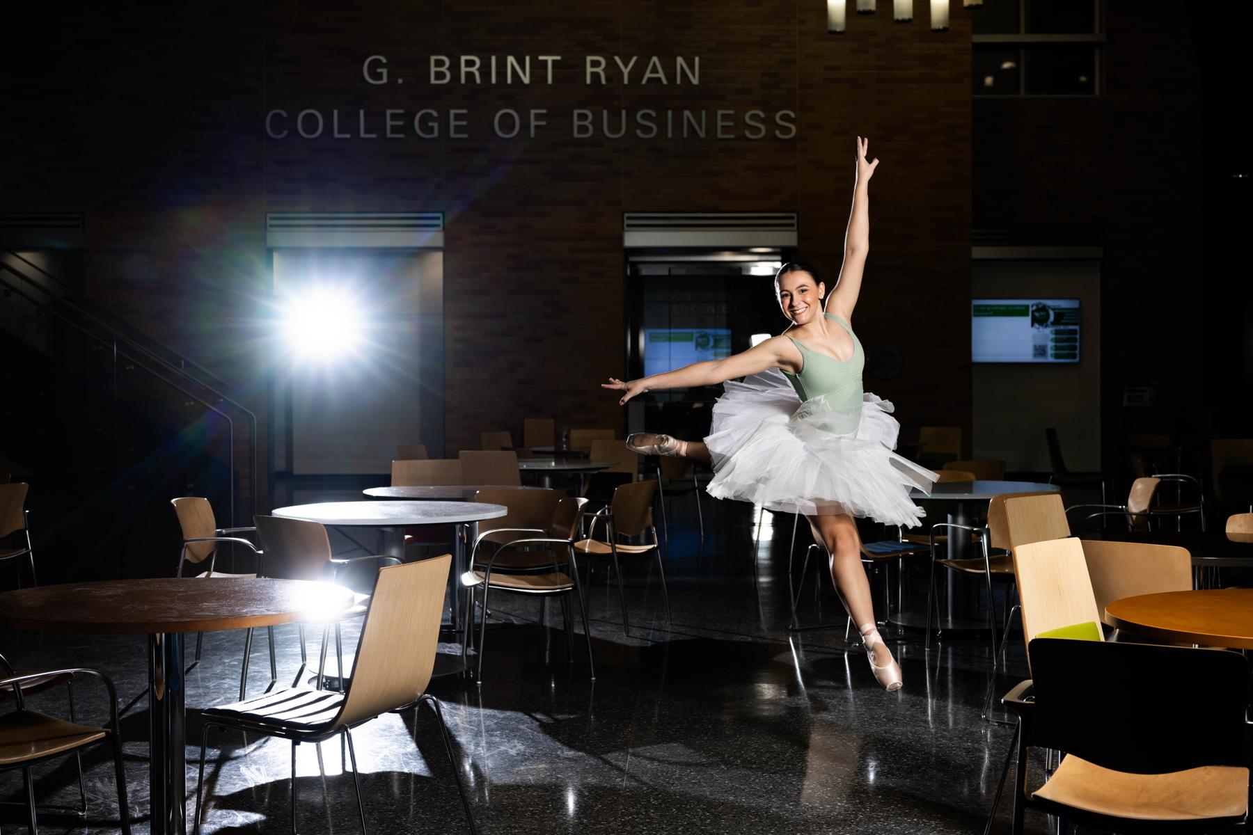 Reece Domingue performs a grand jeté in the UNT business building atrium.