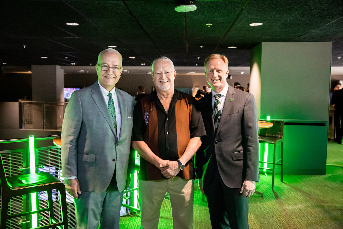 College of Music Dean John Richmond, James Thomason, UNT President Harrison Keller stand together in a row smiling at the camera