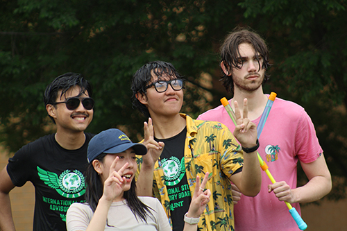 Students pose after a water fight at the Songkran Water Festival