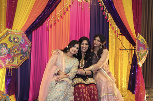 UNT students posing in traditional dress