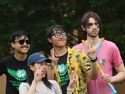 Students pose after a water fight at the Songkran Water Festival