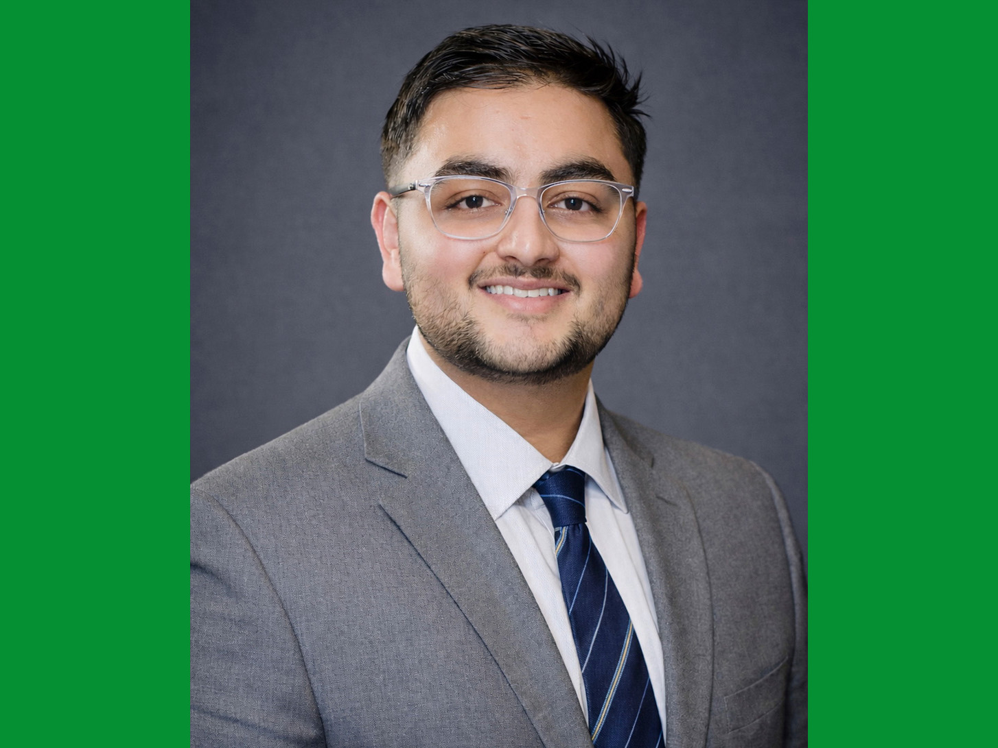 A portrait photo of Eeshan Joshi in a suit.