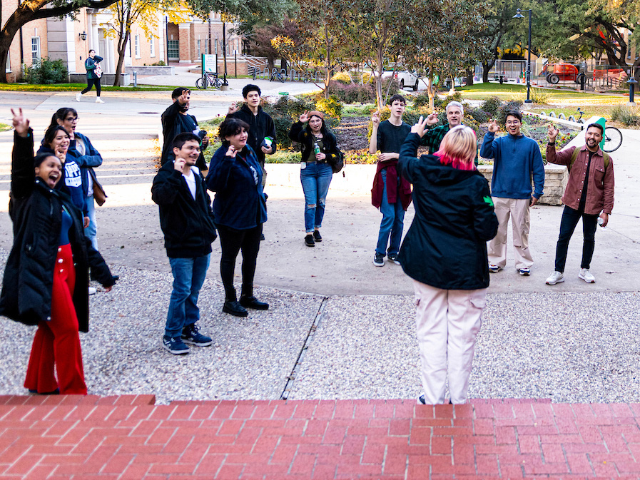 A UNT Transfer Ambassador leads prospective students and families on a tour of campus