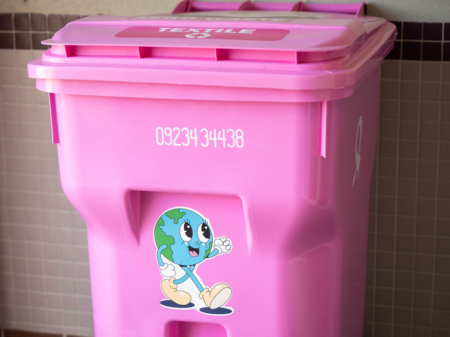 Earthy Sticker on a Pink trashcan