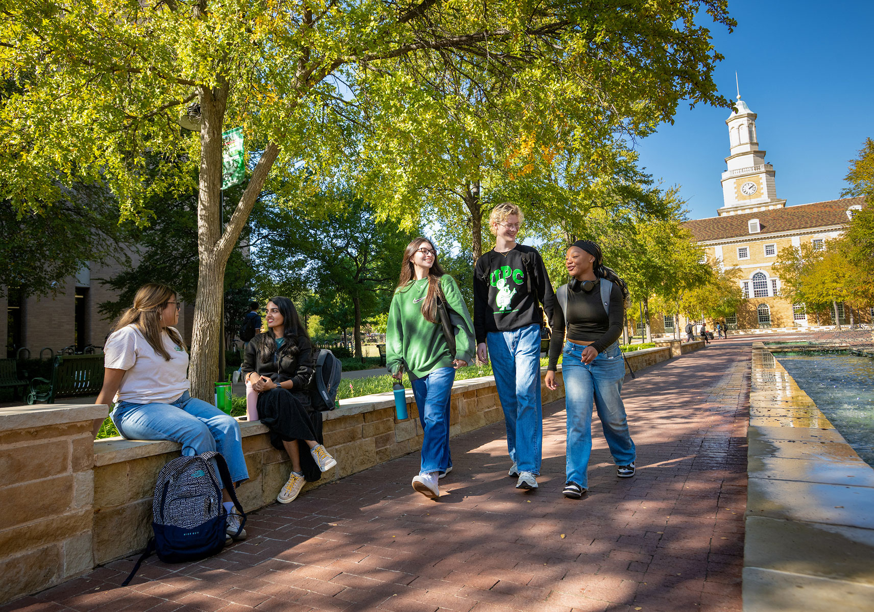 UNT students walk on campus