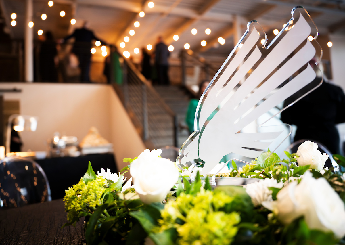 The diving eagle symbol as a white trophy placed on a table