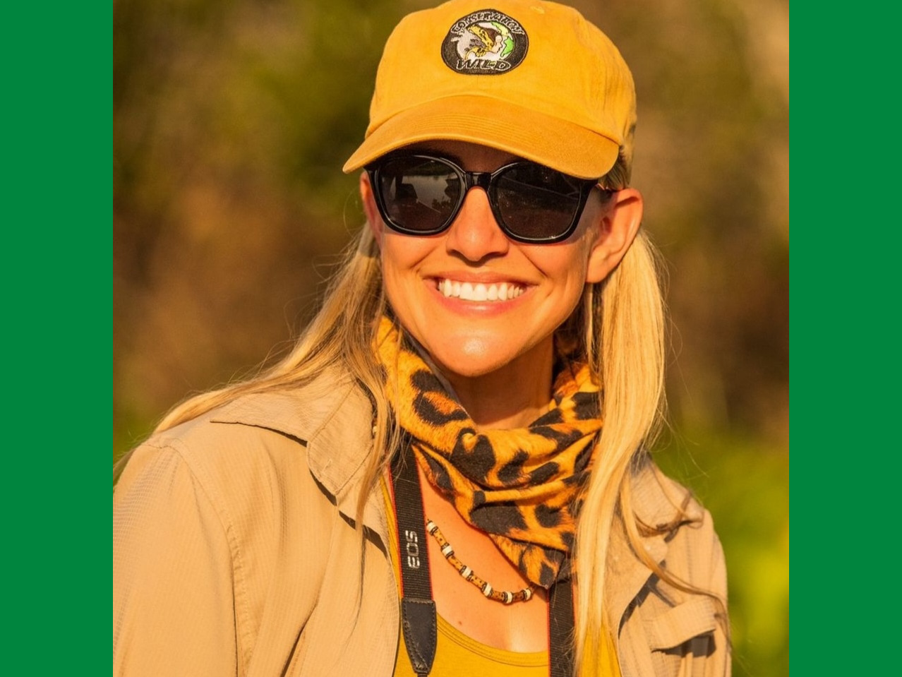 An outdoor headshot of April Kelly wearing a Conservation Wild hat