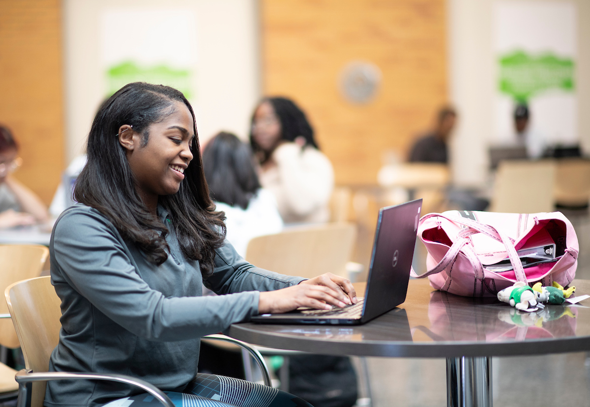 Student on a computer on campus