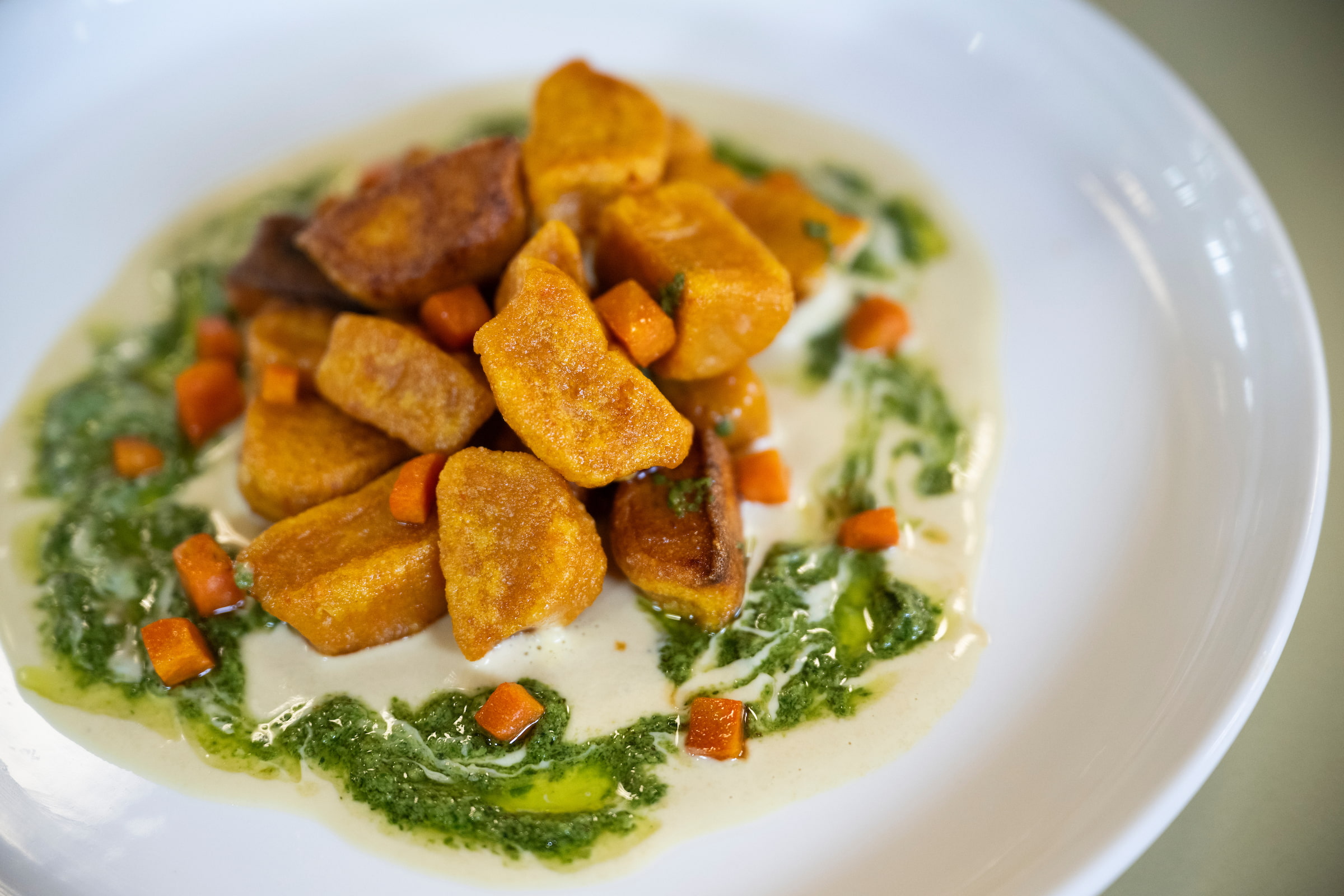 a carrot gnocchi dish made of carrots from Mean Greens Cafe