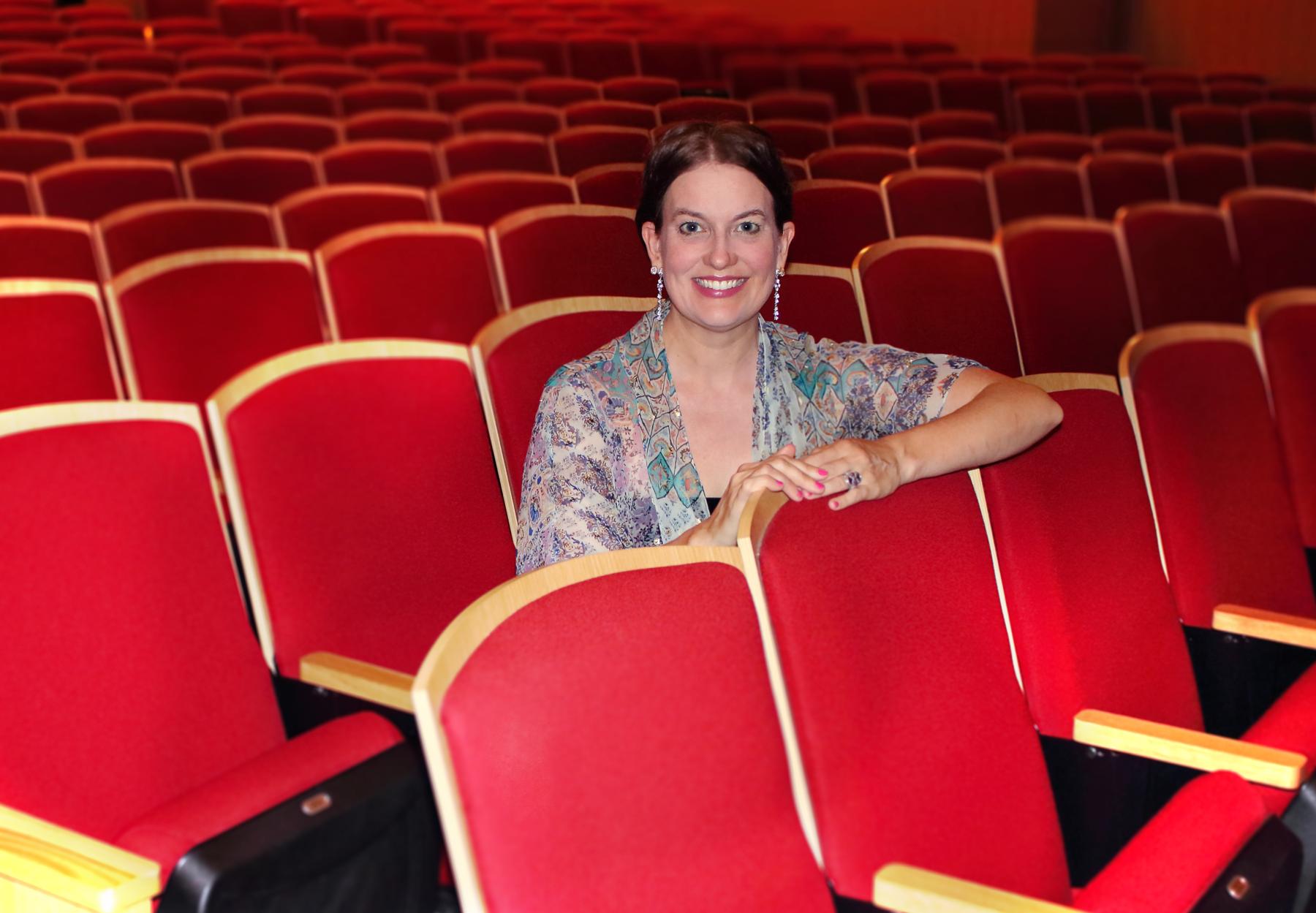 Molly Fillmore seated in a theatre.