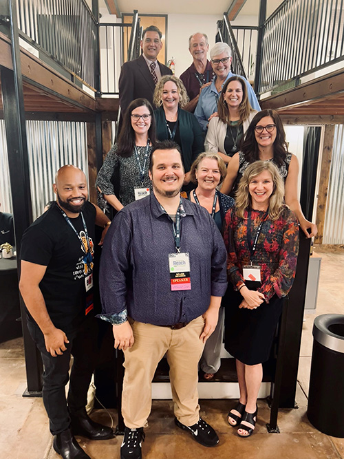 Board members pose on the Denton CoLab staircase