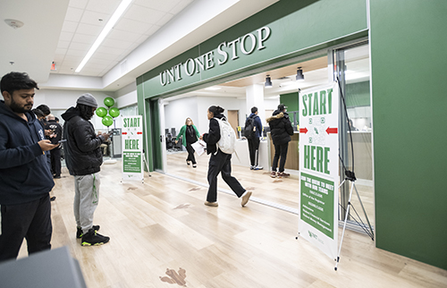 People waiting outside of the new UNT One Stop