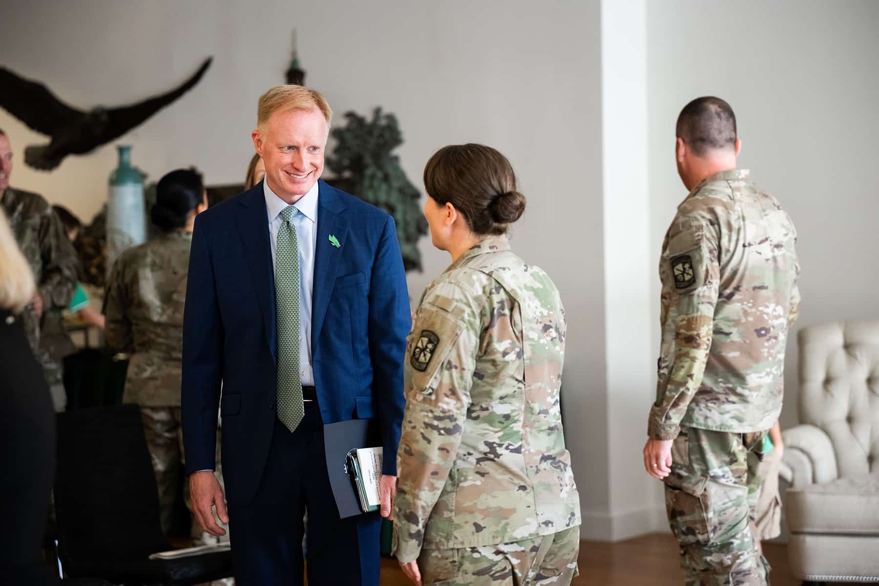 UNT President Harrison Keller talks with a cadet