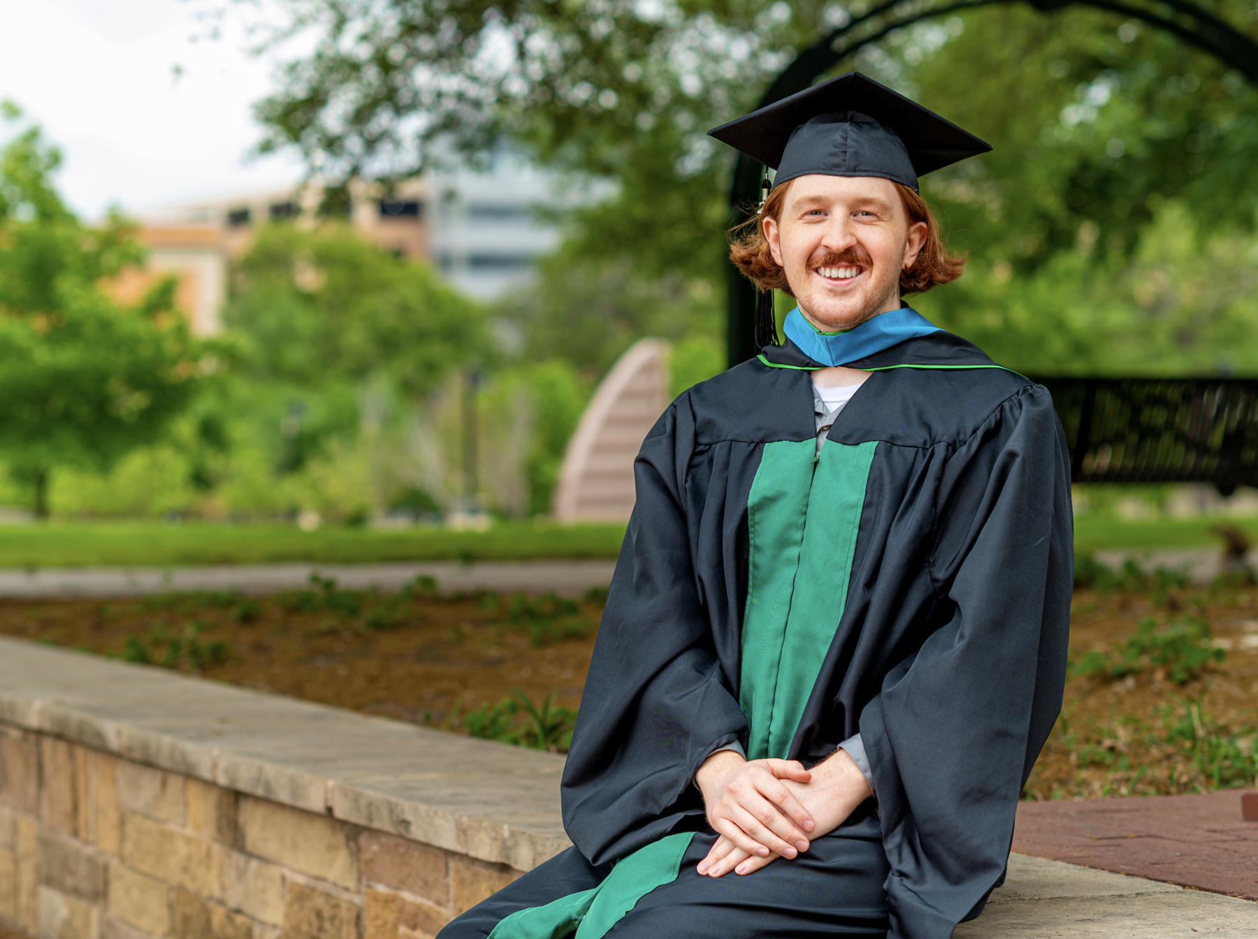 Charles Wood wearing graduation gown