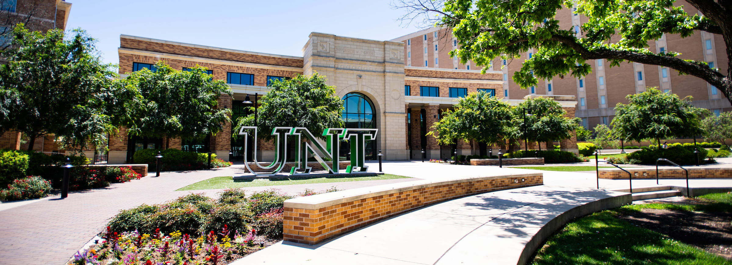A shot of the UNT sign in front of the Welcome Center