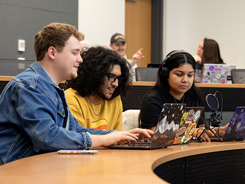 Students in Wesley Phelps's Texas LGBTQ History class work on their podcast