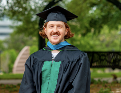 Charles Wood wearing graduation gown