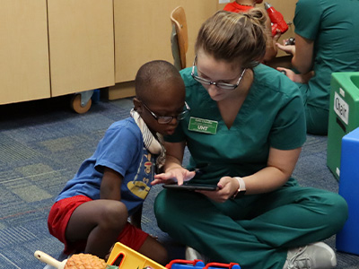  UNT Audiology & Speech-Language Pathology student, Katie Chandler, offering services at the Speech and Hearing Center 