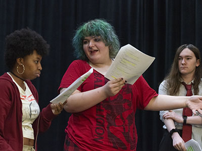 Students rehearse lines for a play