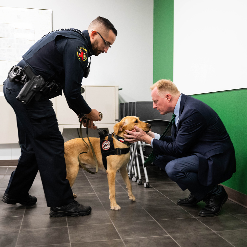 Police dog and his minder meeting Harrison Keller