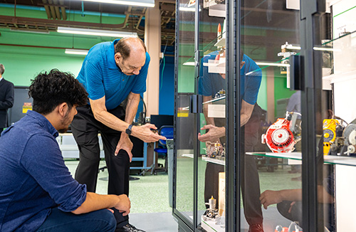 Wes Pettinger explaining part of the collection to a student