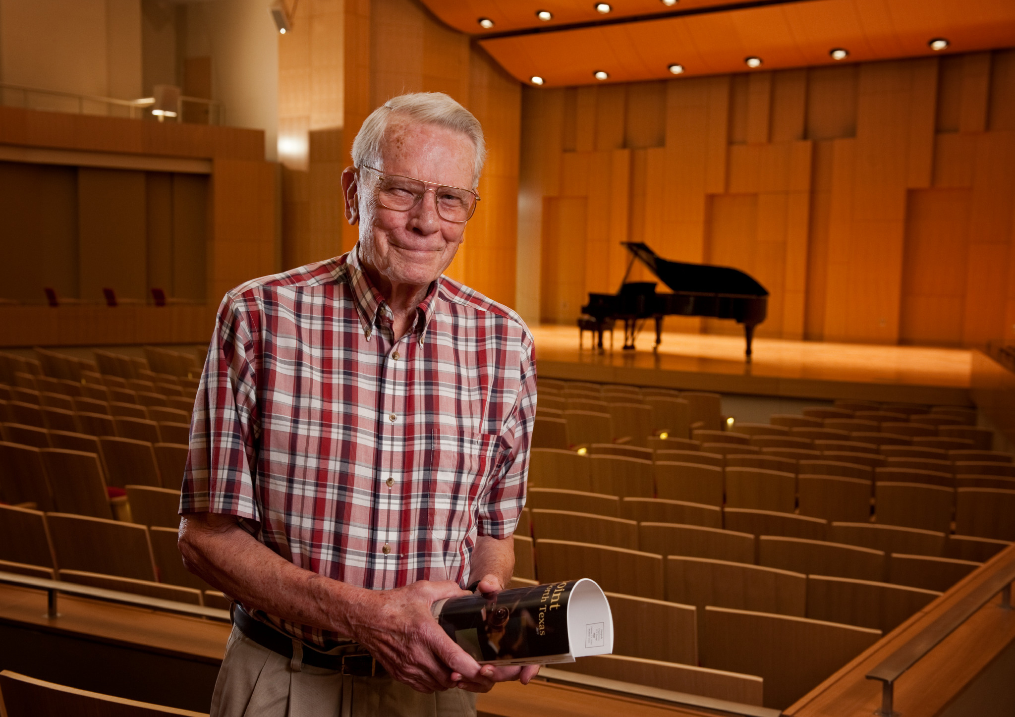 Paul Voertman stands in his namesake concert hall at the University of North Tex