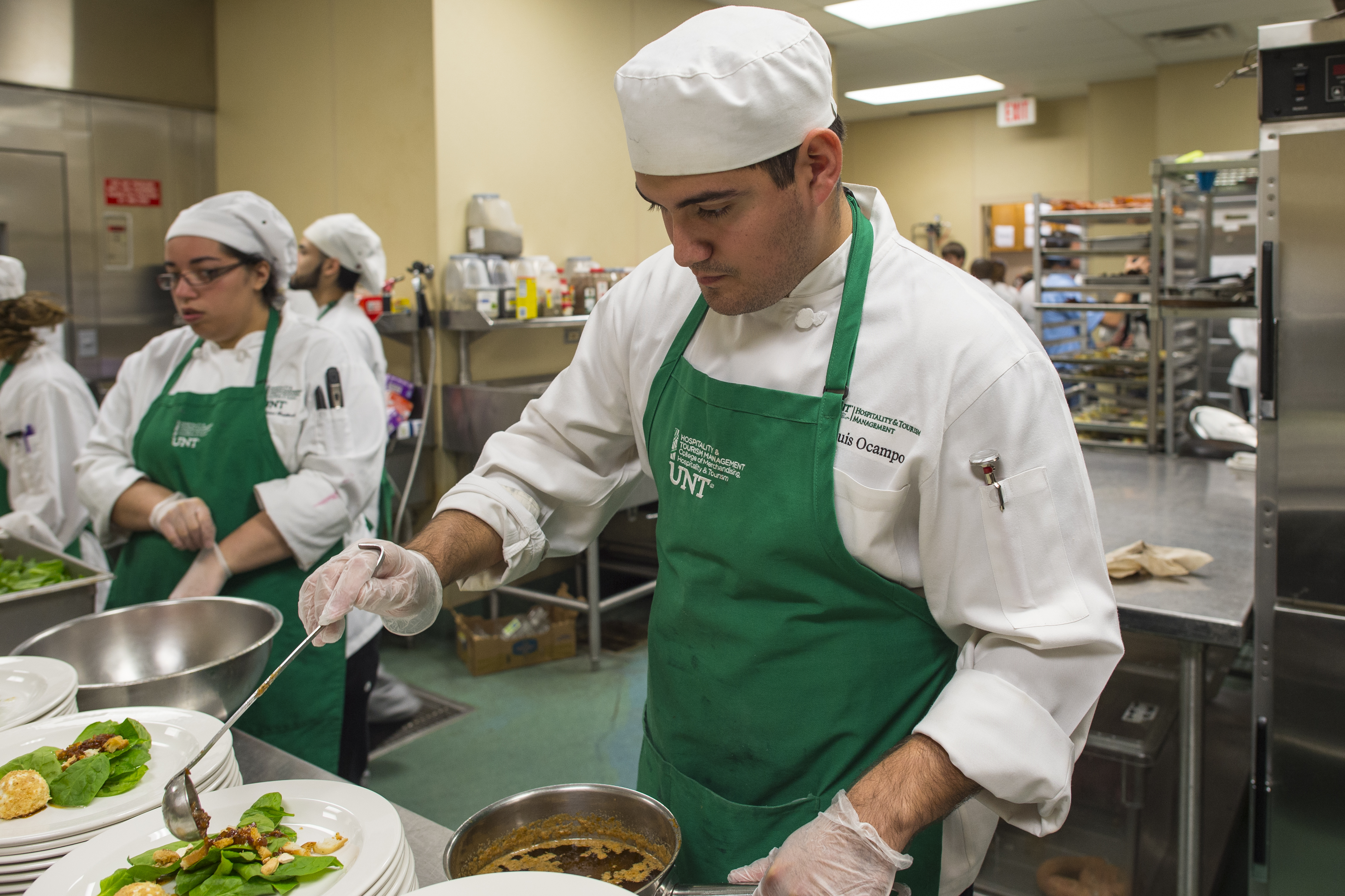 Students at UNT’s Club at Gateway Center prepare three-course meals during a previous Guest Chef Day. 