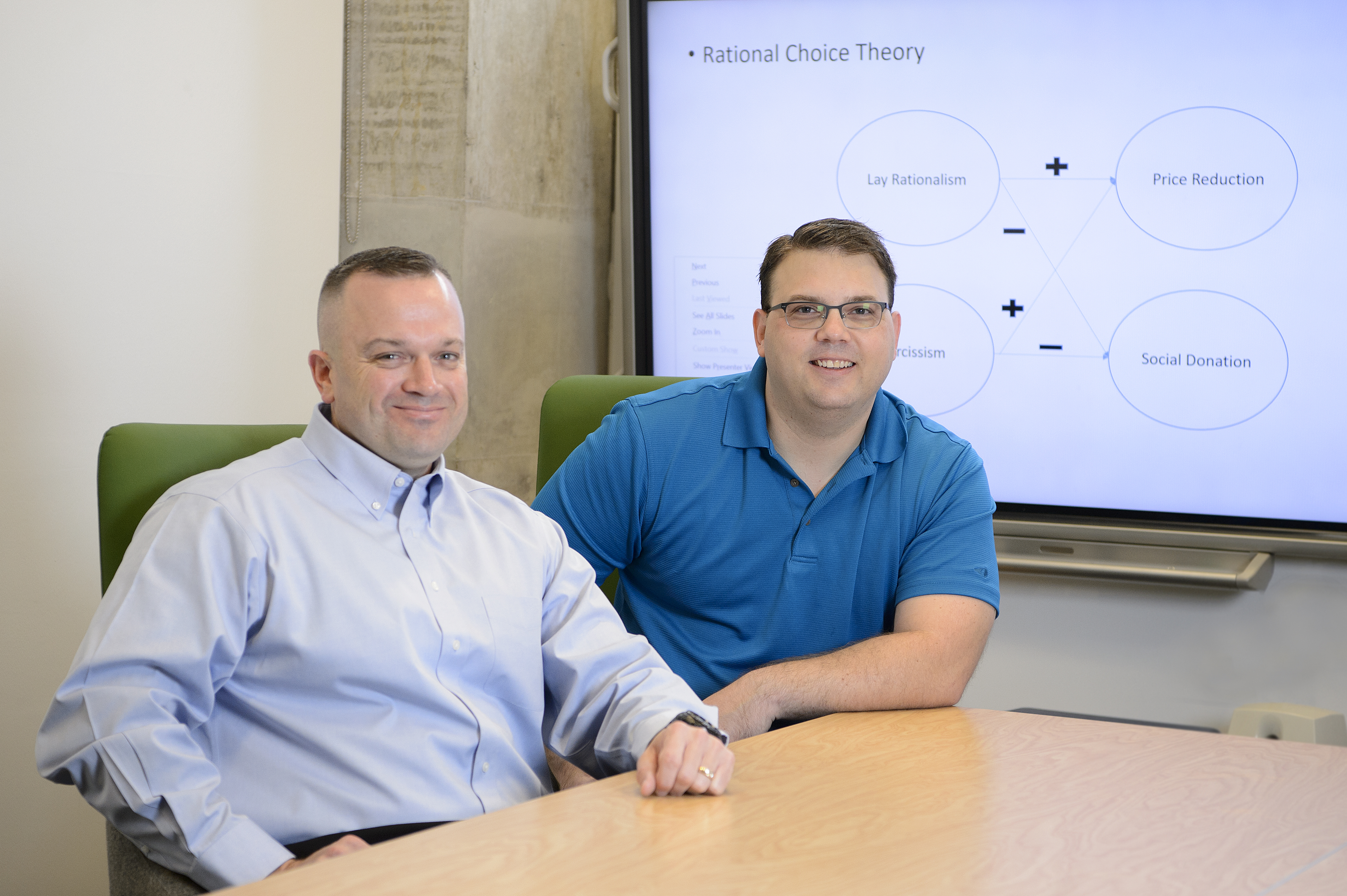 Air Force Maj. Aaron Glassburner (left) and Lt. Col. John Dickens (right), two service members who are completing their doctoral degrees at UNT as part of a unique program with the Air Force Institute of Technology that provides professional training and continuing education opportunities for service members.