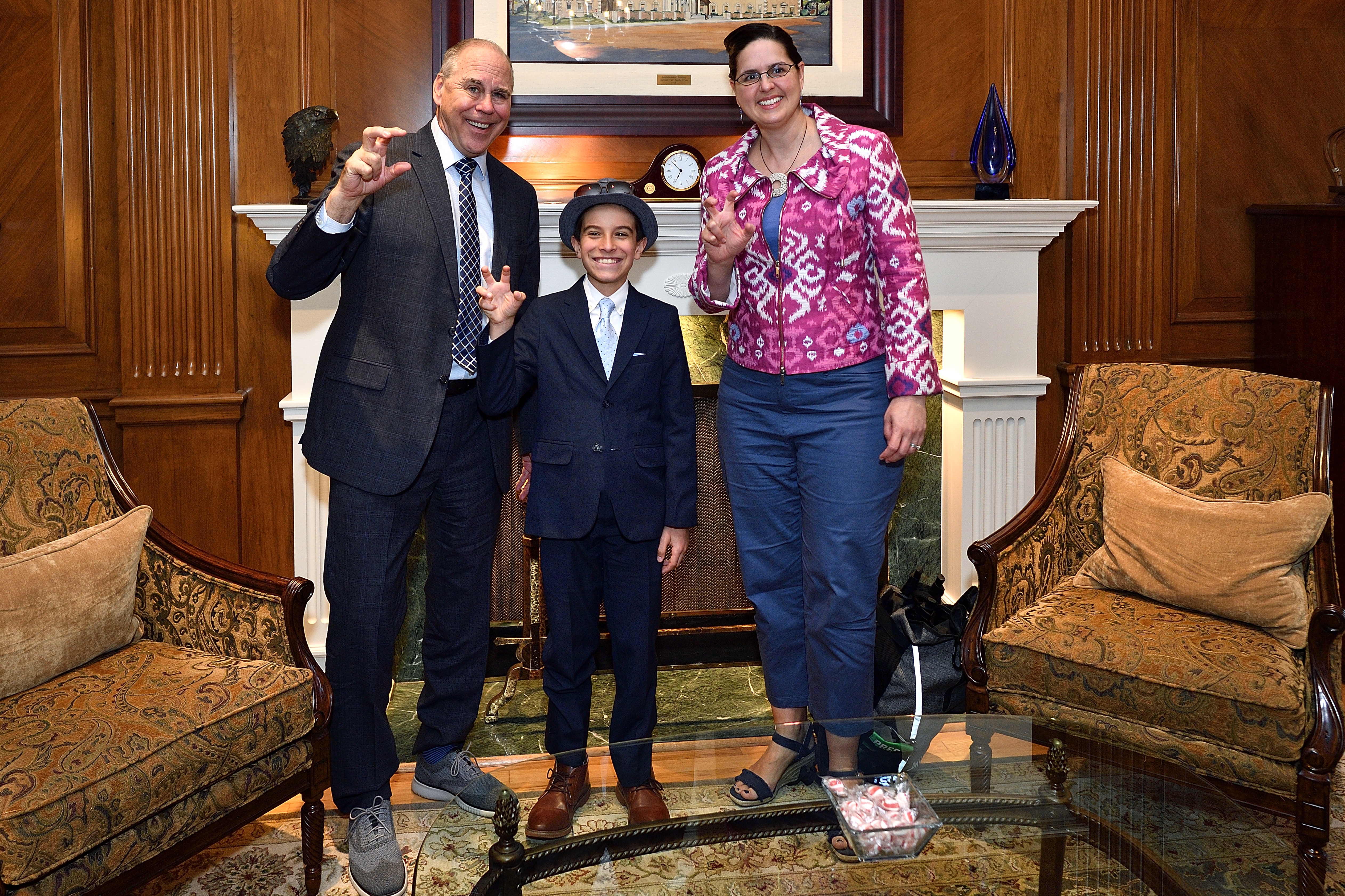 11-year-old Phoenix Legg visits with UNT President Smatresk and Provost Jennifer Cowly
