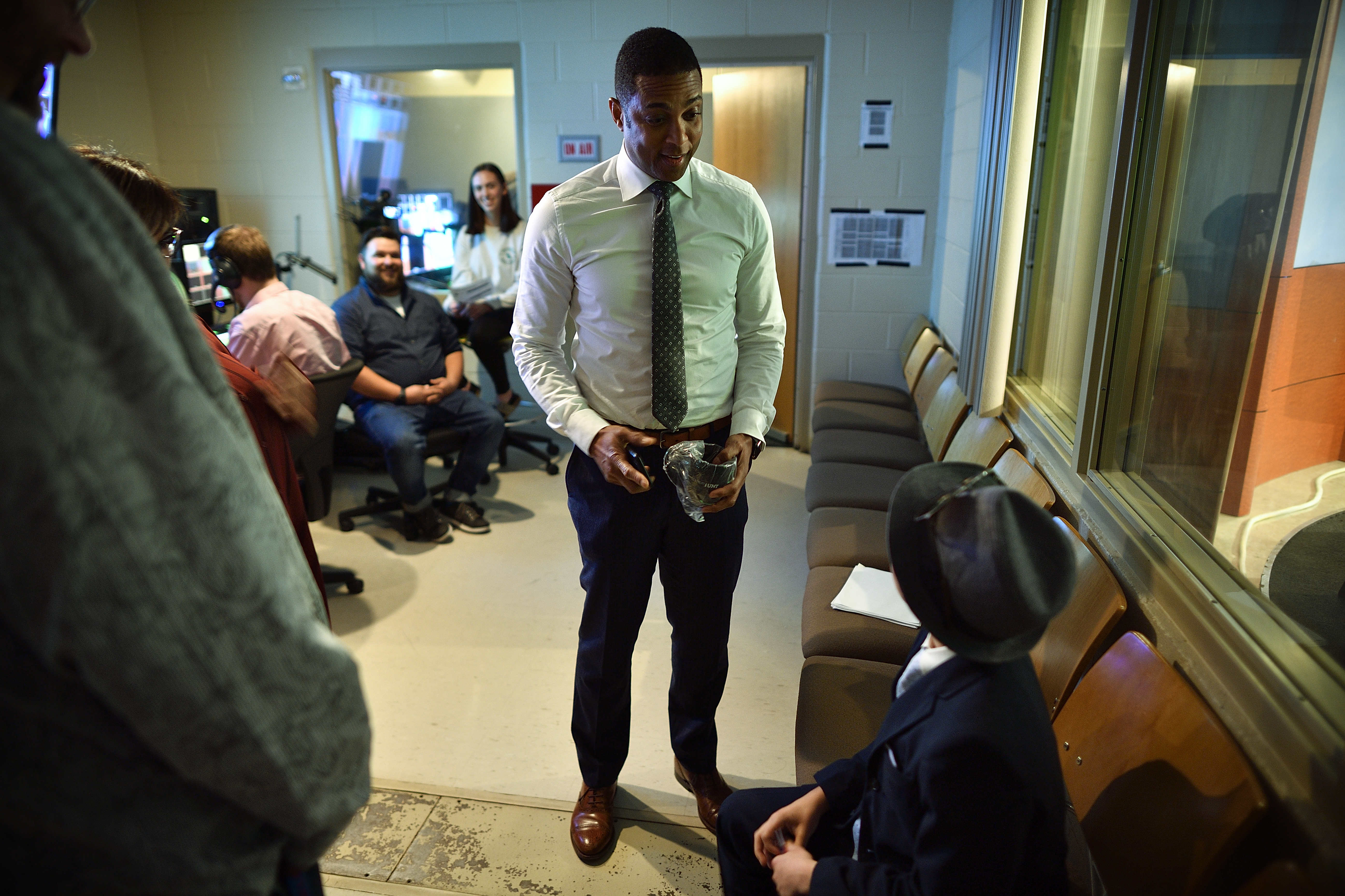 11-year-old Phoenix Legg (seated) meets CNN's Don Lemon behind the scenes at UNT's Distinguished Lecture Series. 