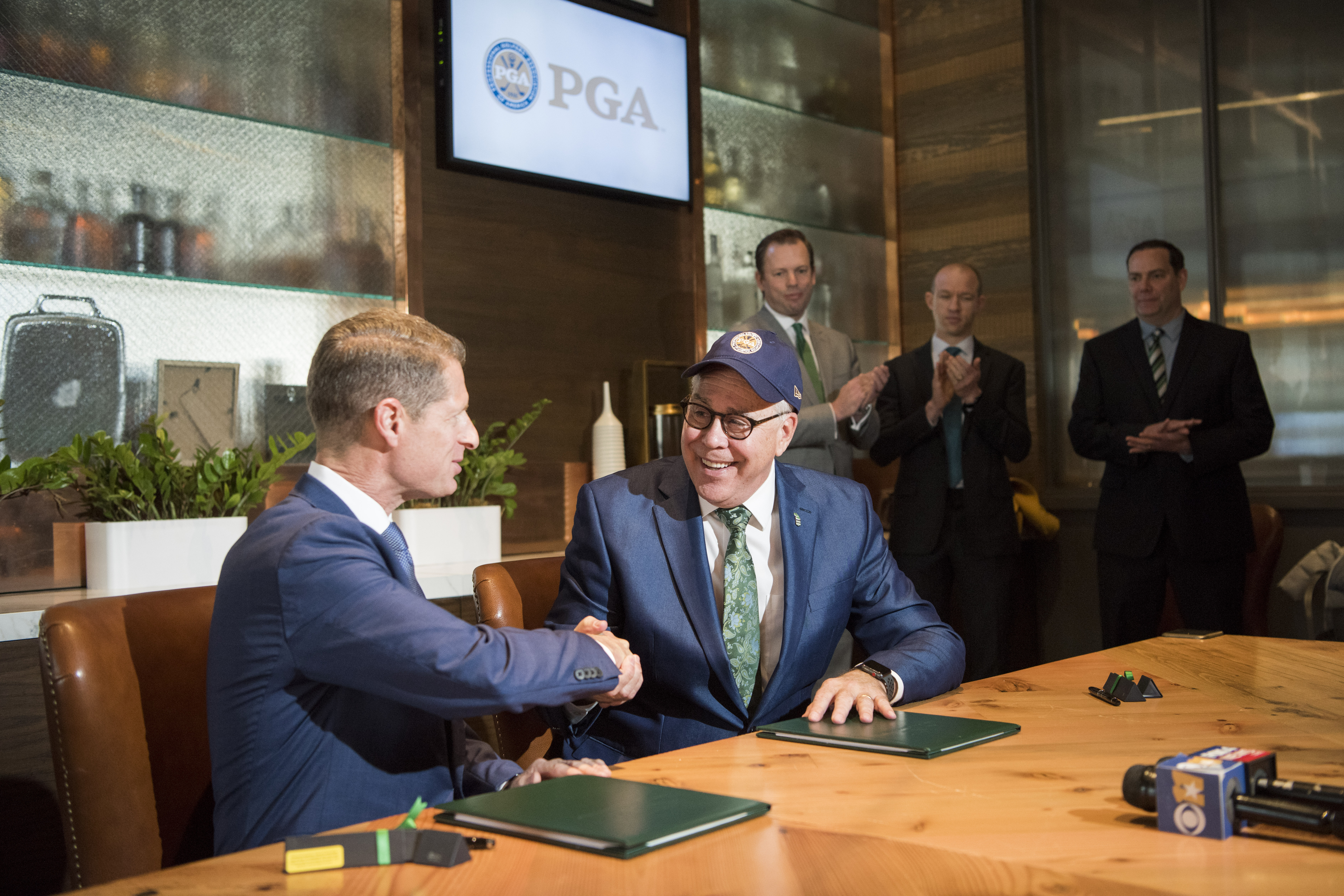 PGA Chief Operating Officer Darrell Crall and UNT President Neal Smatresk